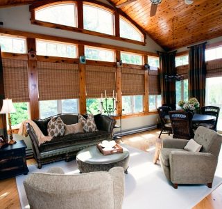 Deer Lake Renovation Veranda Room with window and custom wood treatments.